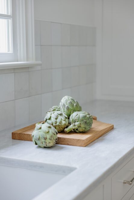 kitchen-counter-detail-artichokes-cutting-board